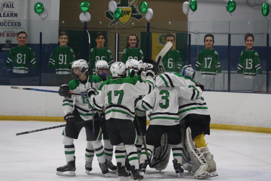 PV/PH/PR hockey players celebrate during a game from this past season. Park Ridge students joined Pascack Hills and Pascack Valley on the team for the first time this past season. 