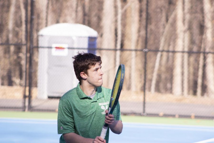 Vasili Karalewich looks to hit the ball back towards his opponent. The boys tennis team will be competing for the first time since 2019, with the 2020 season being shut down due to COVID-19.