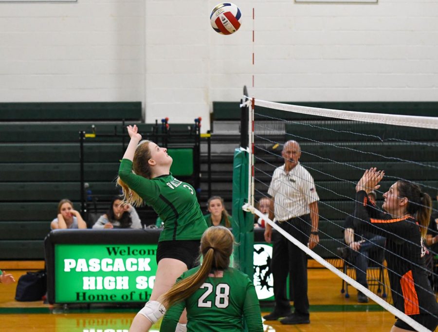 Junior Jenna Joroff winds up to hit the ball over the net.