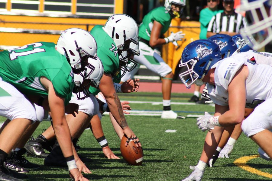 Pascack+Valley+and+Demarest+get+set+at+the+line+of+scrimmage.+The+Indians+went+on+to+defeat+the+Norsemen+48-18+in+Valleys+Homecoming+game+on+Sept.+28%2C+and+the+two+teams+are+now+set+for+a+rematch+in+the+playoffs.