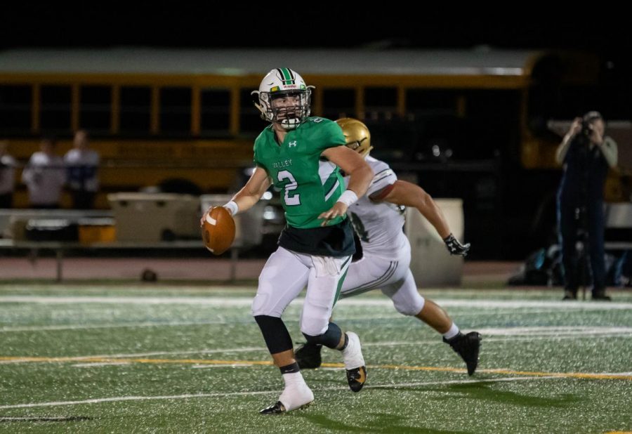 Senior quarterback Stephen Begen rolls out of the pocket while looking to pass. He finished with 151 passing yards, two total touchdowns and two interceptions in Valleys 21-12 loss to Old Tappan on Friday night.