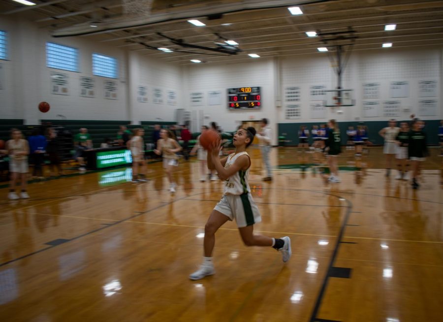 Freshman Lindsay Jennings drives to the basket for a layup before the girls basketball game against Northern Valley Demarest on Thursday, Jan. 16.
