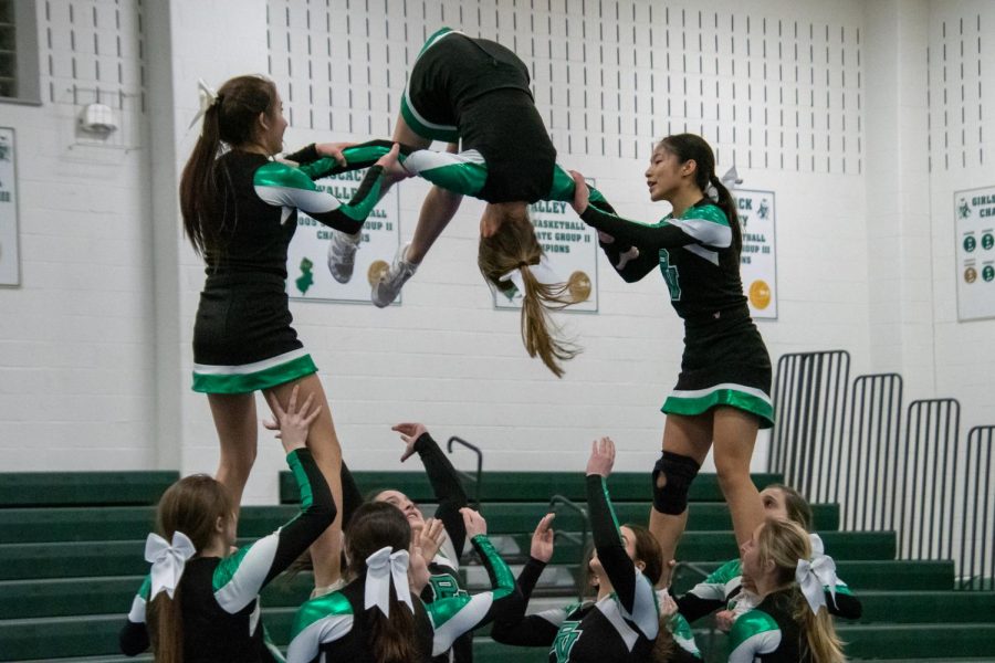 The+cheer+team+performs+a+stunt+during+its+routine.