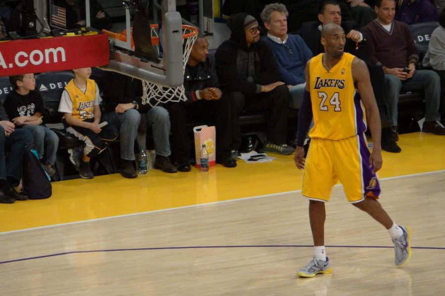 Kobe Bryant approaches the Lakers bench in a 2013 home game against the Bucks. Bryant died Sunday in a helicopter crash at age 41.