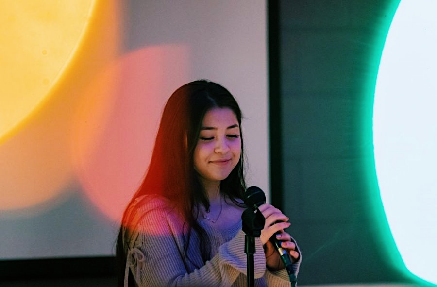 Junior Elise Schicker sings Rainbow by Kacey Musgraves during the Lit Out Loud event on Tuesday, Feb. 4.