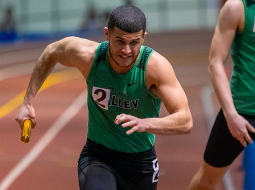 Andrew Martinez runs in a relay at The Armory in New York City.