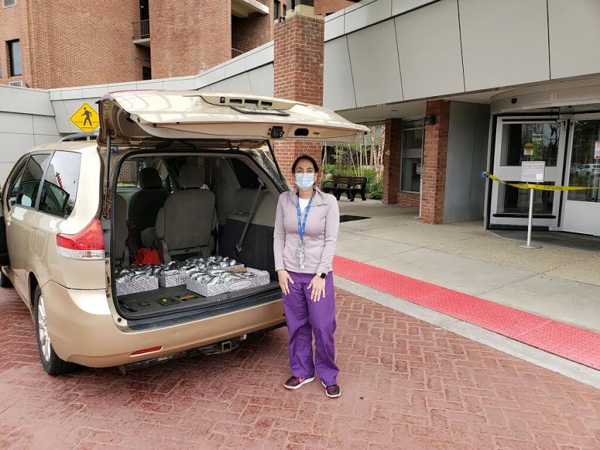 A nurse picks up meals delivered to the hospital from Ridgemont Pizza & Restaurant in Park Ridge. Pascack Hills teachers Virena Rossi, Kaitlyn Mahaffey, Charleen Schwartzman, and Deb Horn created a GoFundMe page to provide meals for healthcare workers at Hackensack Meridian Pascack Valley Medical Center in Westwood. 