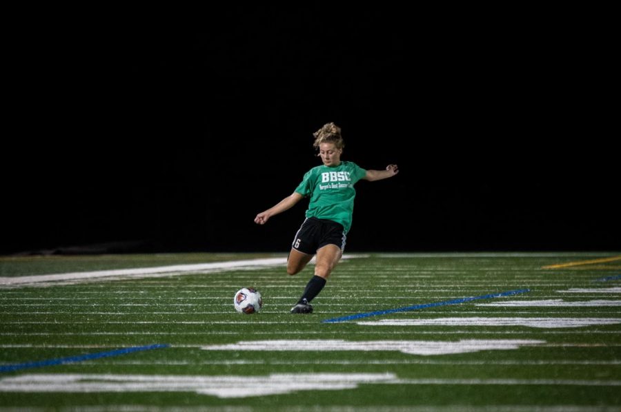 Senior Nicole Ingannamorte kicks the ball into the open field. The girls soccer teams season begins Thursday night.
