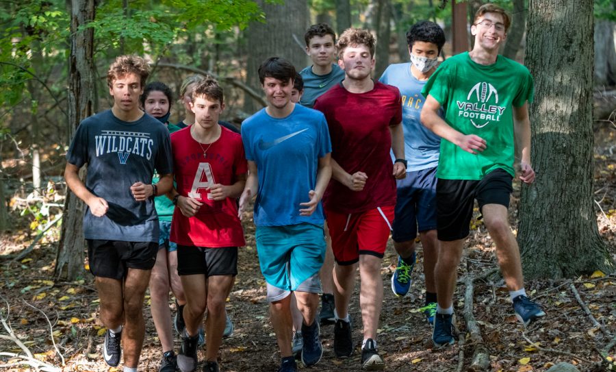 The Pascack Valley cross country team runs on a trail in practice. The team will lean on its senior leadership and production from its youth this season.