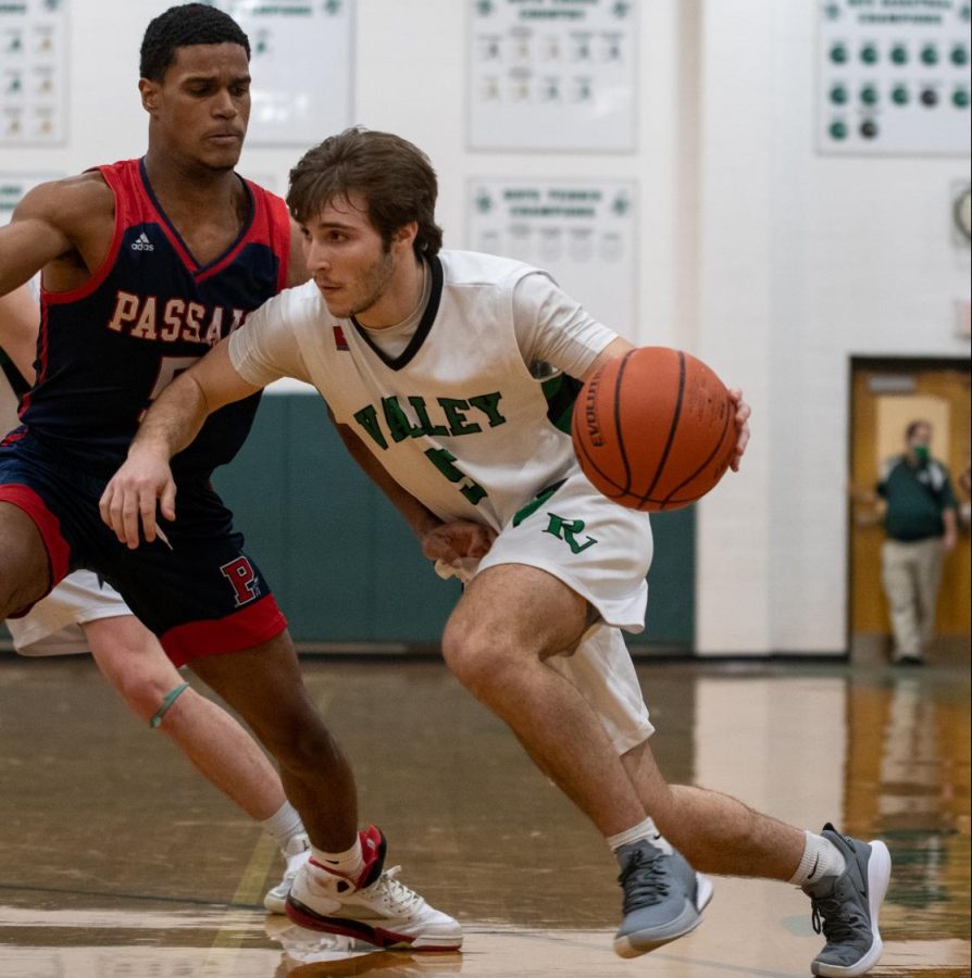 Jake Wolf attempts to get by the defender. Pascack Valley defeated Passaic Valley at home by a score of 52-41 Thursday night, and Wolf is the Athlete of the Week.