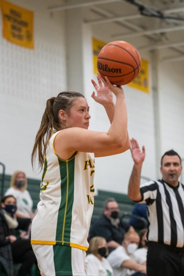 Jules Vassallo shoots for a three pointer. She was a main contributor for the girls basketball team this week.
