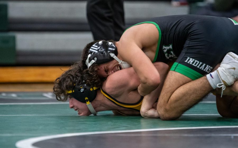 Sr.+Matt+Bainbridge+gets+his+opponent+down+for+two+points.+The+wrestling+teams+will+use+experienced+senior+leadership+to+propel+them+towards+a+league+title.