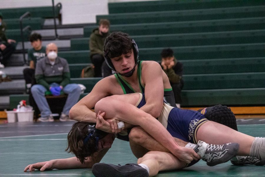 Junior+Antonio+Cedeno+makes+a+move+on+his+opponent.+After+his+successful+sophomore+season%2C+he+and+other+returning+wrestlers+look+to+have+another+successful+season+this+year.+
