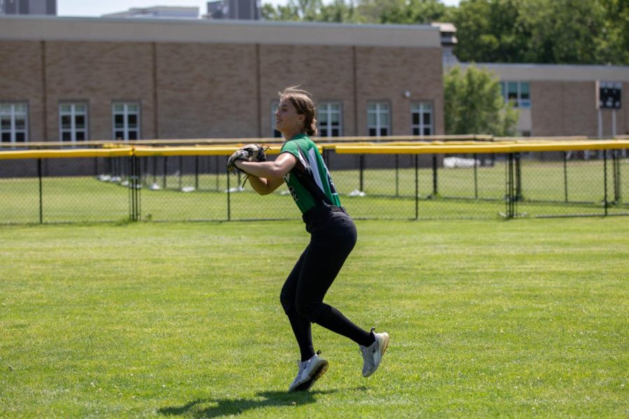 Selby looks to throw out a player at home. She is this months athlete of the month after racking up 33 hits this season.