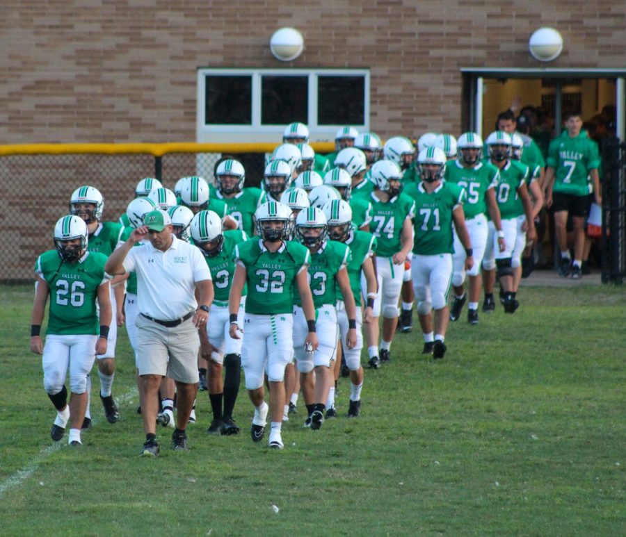 The Pascack Valley football team walks out of the locker room before their opening bout against Ramsey. 