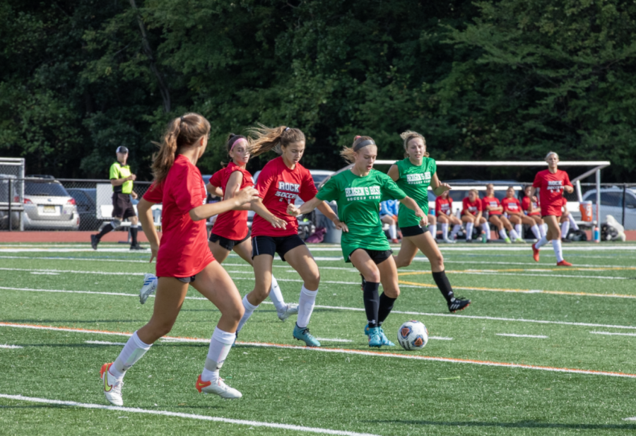 Amanda Polyniak attempts to turn the defender and go upfield. The girls soccer team looks to build off its sectional title run last year with new coach Leah Jerome. 