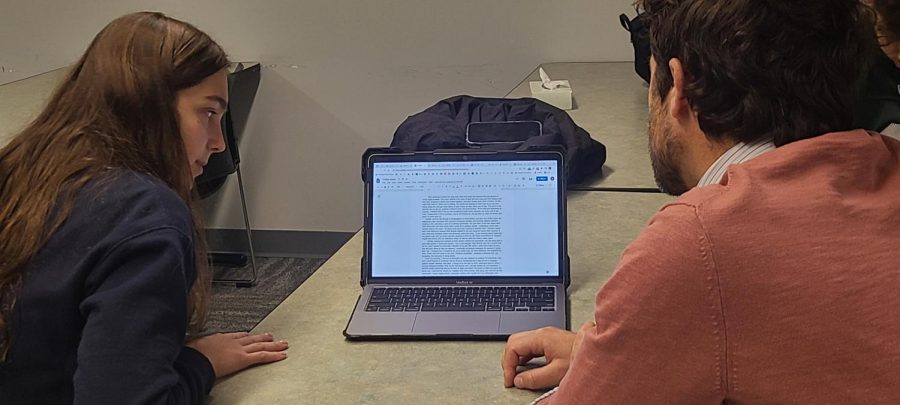 Pascack Valley English teacher Daniel Phillips helps a student in the PV Writing Center.