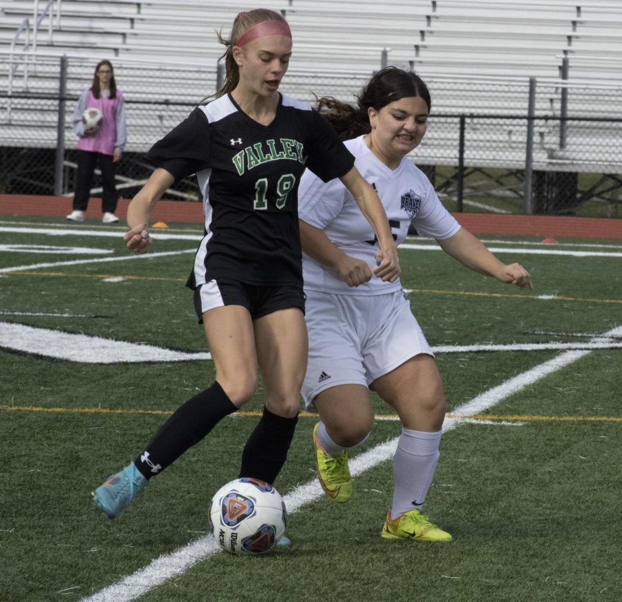 Amanda Polyniak works against a defender in a game last season. She is Septembers Athlete of the Month.