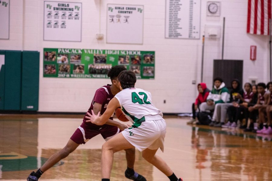 Devin Merker (Jr.) closely defends his opponent. The Boys Basketball Team looks to get back on track after a couple tough losses. Read more about them and other winter sports below. 