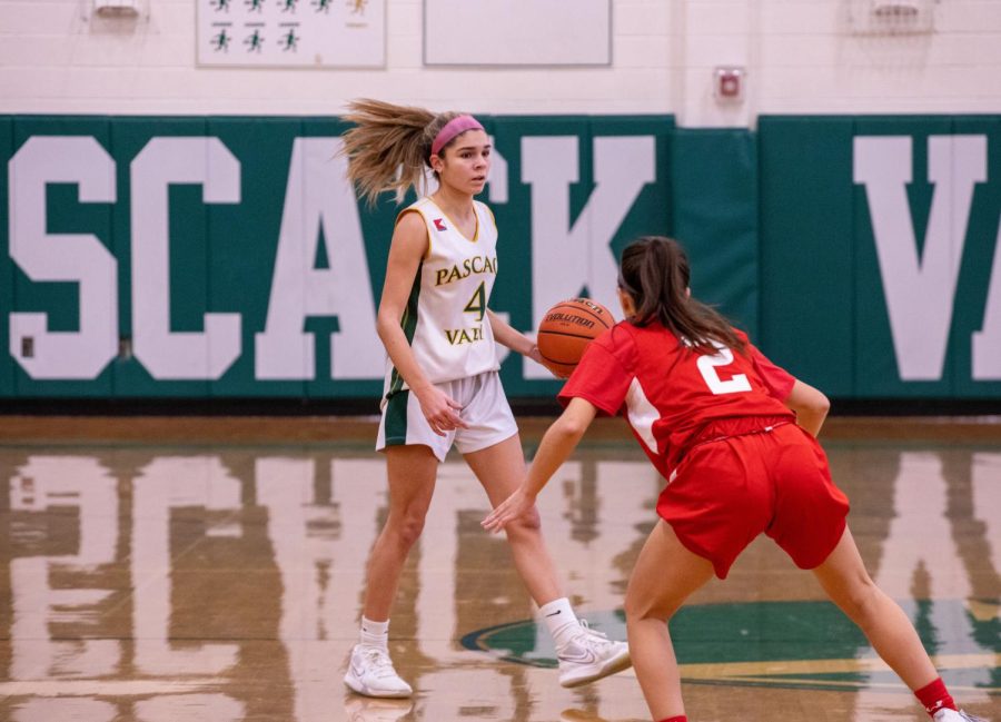 Celian Bussanich (Jr.) dribbles up the court. The girls basketball team is 1-1 to start the season.  Read more about the girls basketball team and other winter sports below. 