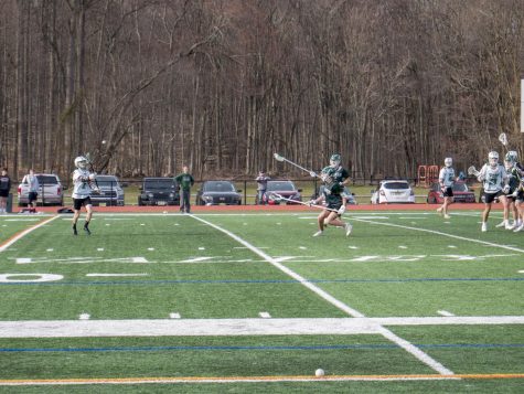 Nolan Wasserman makes a pass to the wing in Wednesdays scrimmage against Ramapo. The Boys Lacrosse Team aims to win the league with newcomers and strong returners.