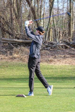 Luke Dolan hits a drive off the tee box. Read more about the Golf Team and other spring sports below. 
