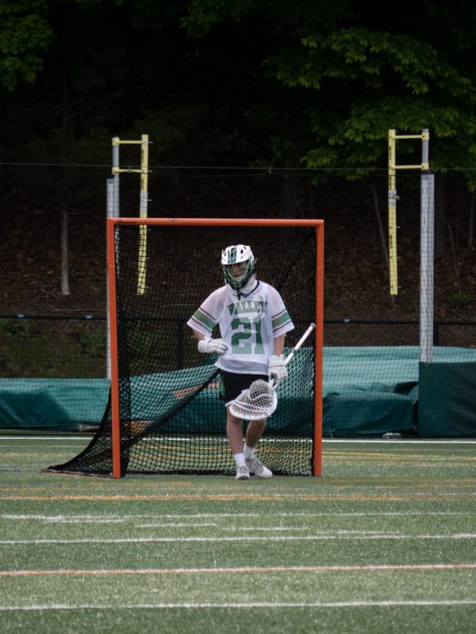 Kevin Wirchansky stands in the goal during the boys lacrosse teams game against Westwood.