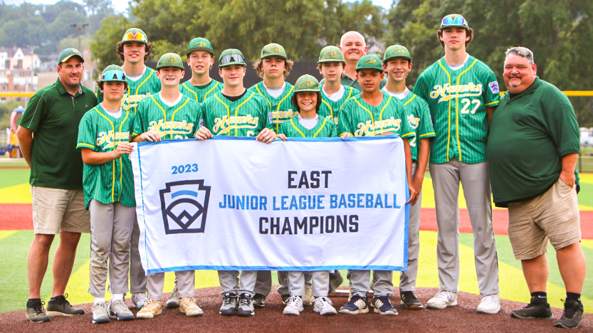 The Hillsdale Hawks 14u baseball team, now students at Pascack Valley, hold their victory banner after securing the East Division in the Junior Little League World Series. This team achieved unprecedented actions and represented their town and families. Read more about it below. 