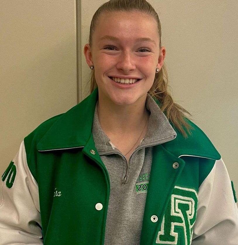 Tara Stewart poses in her varsity jacket. She is Octobers athlete of the month.