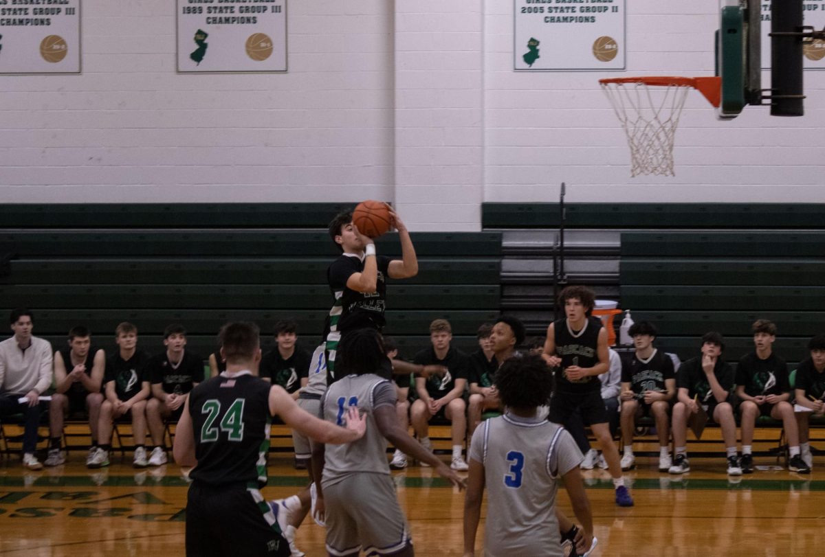 Devin Merker rises above the defense to knock down a shot. The boys basketball team went 3-0 this week, defeating Demarest, Clifton and Dwight-Englewood. Check out the rest of the winter sports recaps below.
