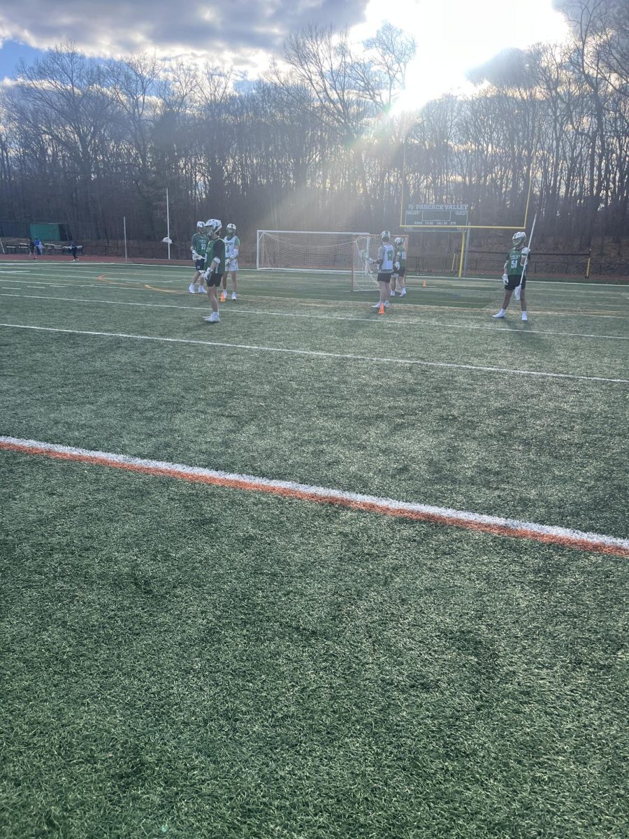The boys lacrosse team works on their defense. The boys look to build off strong midfield and depth.