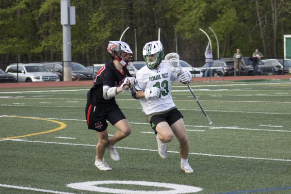 Joe Massaro works around his defender. The boys lacrosse team defeated Paramus in the first round of the sectional tournament and will face West Essex at home on 5/29 in the quaterfinal round.