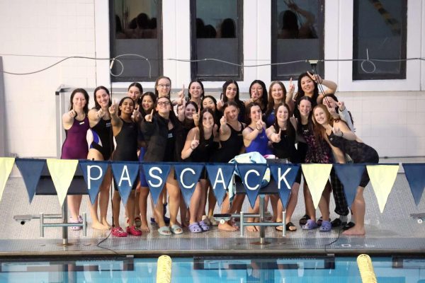 The girls swimming team poses for  a picture. The squads league championship this year earned them the Female Team of the Year award. 