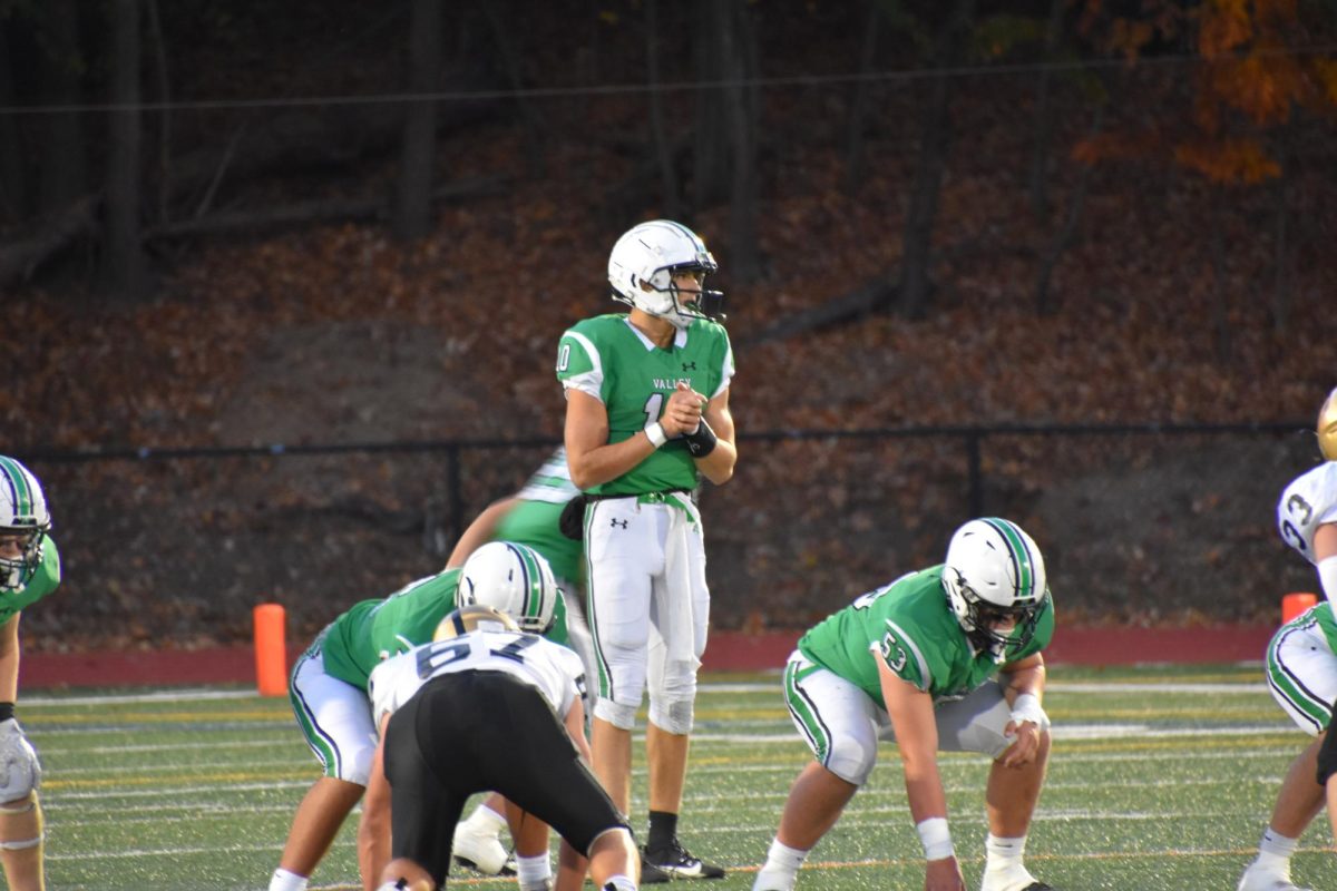 PV Quarterback Adam Shaw looks down field during Valley's Friday night victory over River Dell