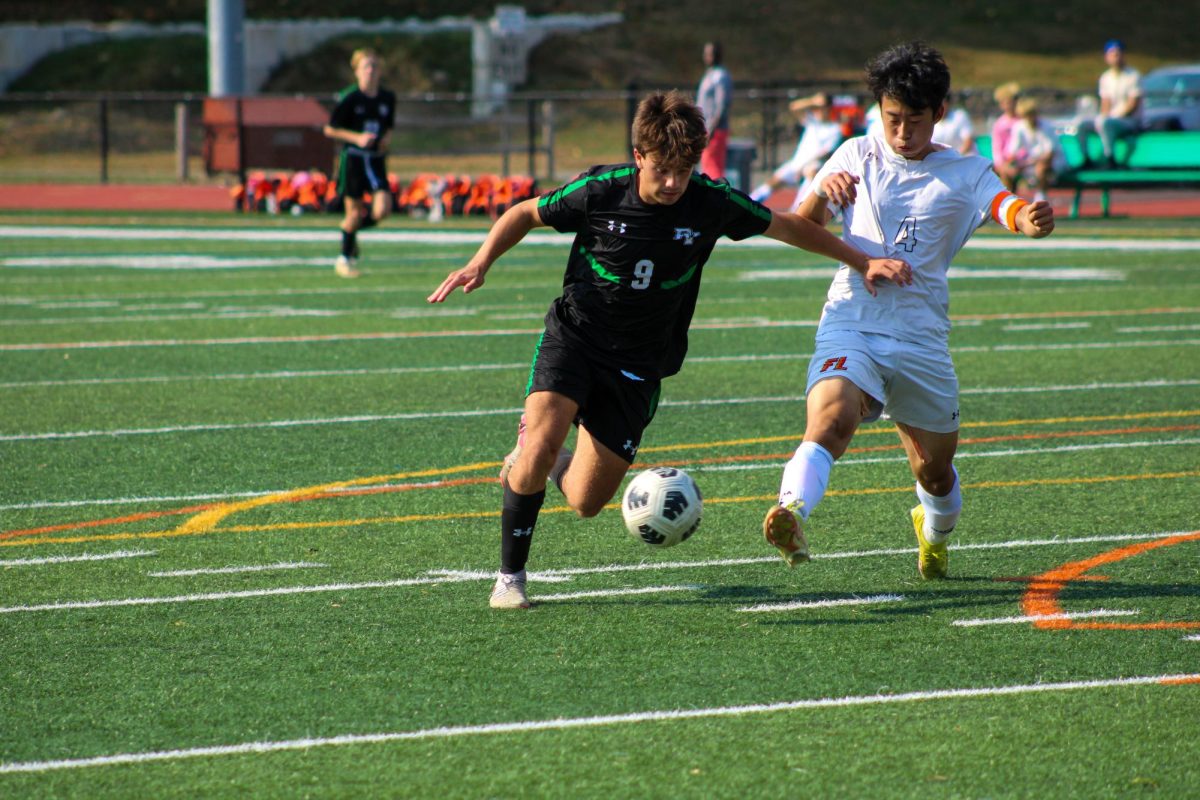 Captain Steven Gifford (Sr.) kicks the ball.