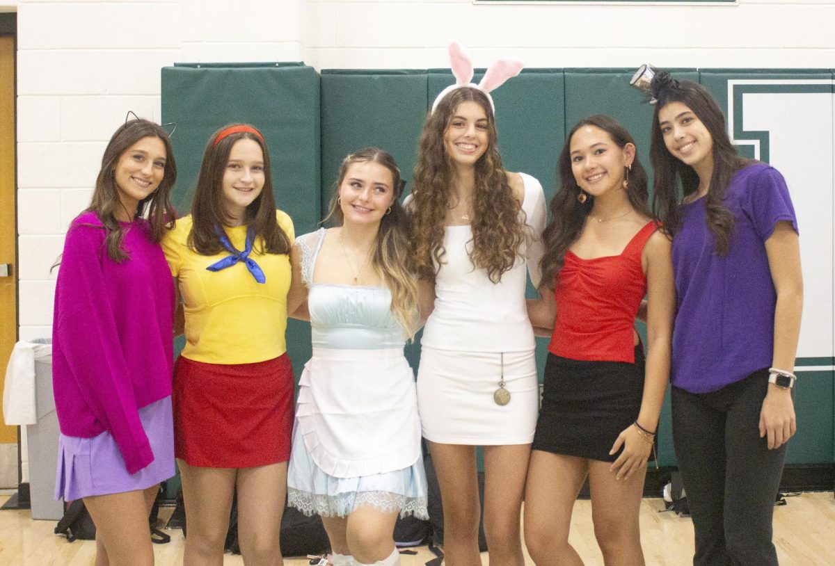 Emma Galasso, Gabrielle Rothenberg, Julie Cameron, Ilda Dervishi, Hannah Fischer, and Emma Nagler dressed up as Alice in Wonderland characters