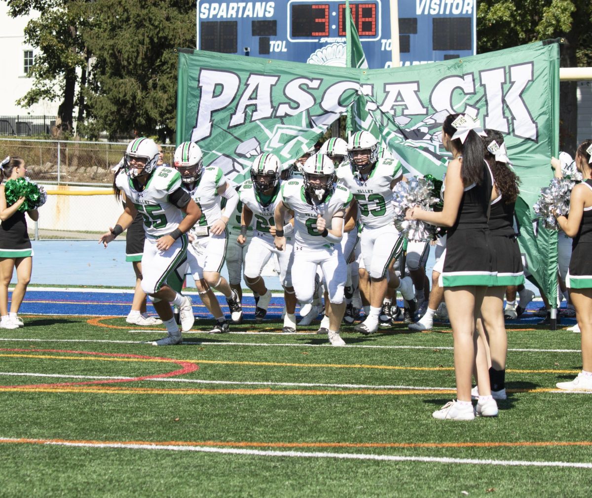 Valley Football runs onto the field.