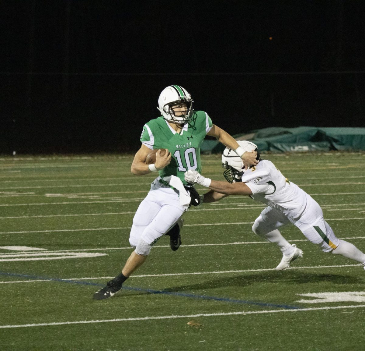 QB Adam Shaw (Jr.) breaks a tackle on Friday night during Valley's victory over Montville