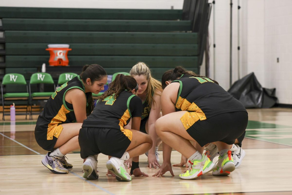 The Girls Basketball Team's starters huddle up before their game against Wayne Hills on Dec. 20