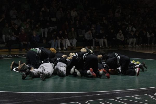 The Pascack Valley Wrestling Team huddles up before its match against Demarest on Wednesday