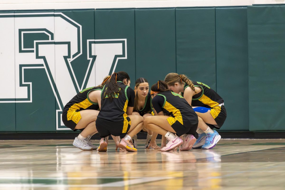 Starters for the Girls Basketball Team rally up before their game against Becton  in the Zack Latteri Benefit Games on Sunday 