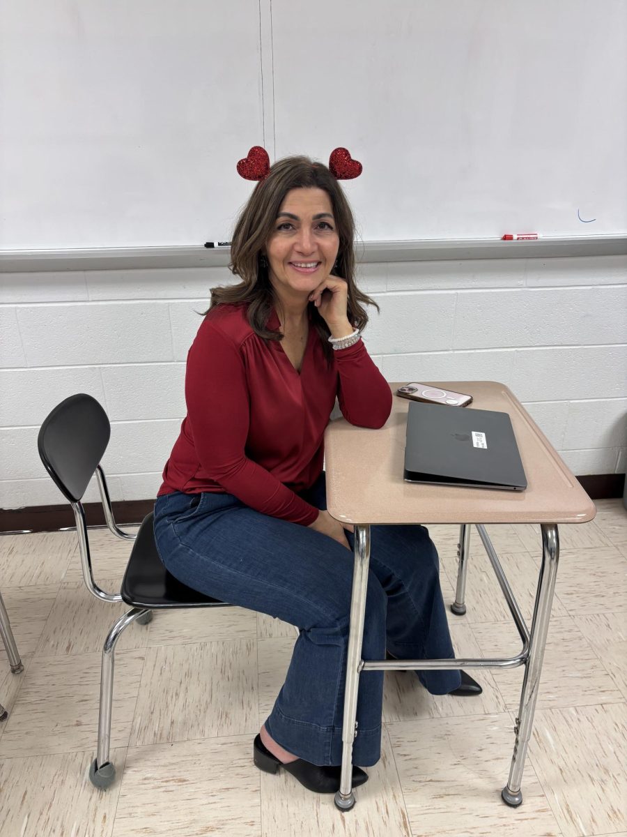 Dr. Argine Safari on Valentine's Day after a day of leading students as they serenaded a number of classrooms throughout the school 