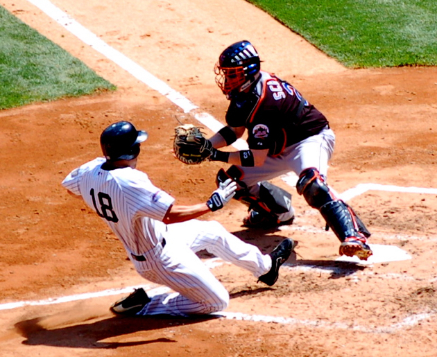 Yankees' Johnny Damon slides into home plate during the 2008 Subway Series