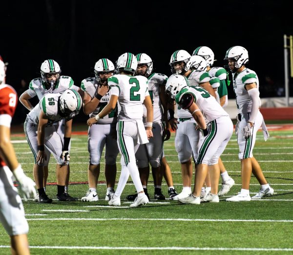 PV Football in huddle during their 21-7 loss against Westwood 