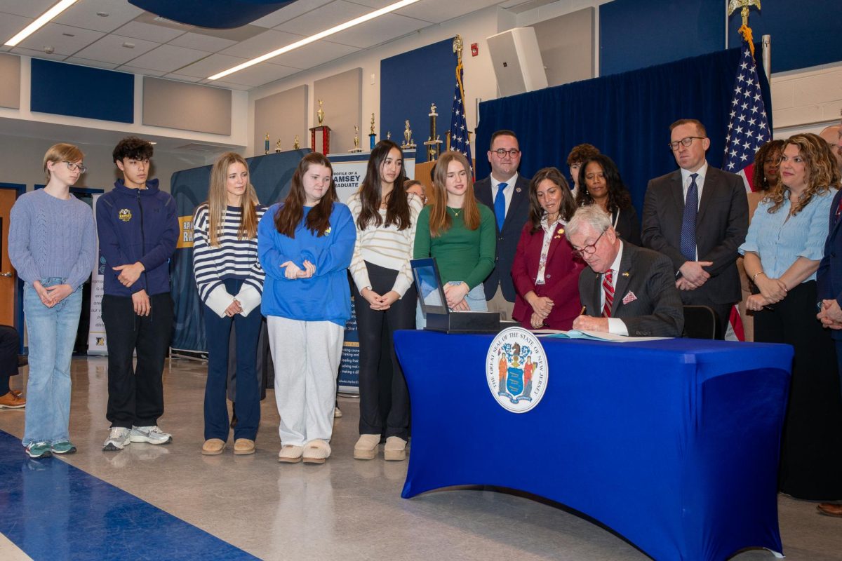 Governor Phil Murphy signing legislation at Ramsey High School that will ban cellphones during the school day