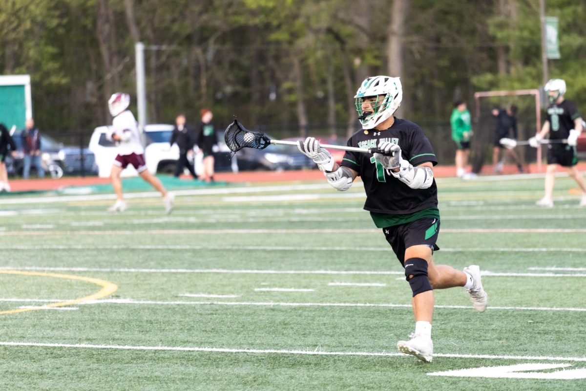 Kai Smith (Sr.) runs with the ball after winning a faceoff of PV Lacrosse 
